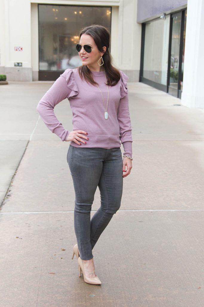 Houston Fashion Blogger Lady in Violet wears a winter outfit idea with a ruffle sweater, gray jeans, and heels. Click through for outfit details.