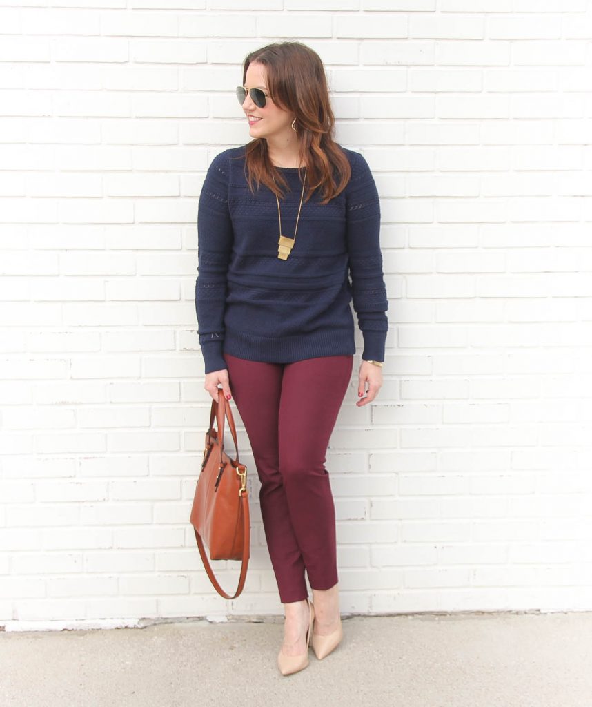 Houston Fashion Blogger Karen Rock wears a winter work outfit featuring a navy sweater and burgundy skinny pants.