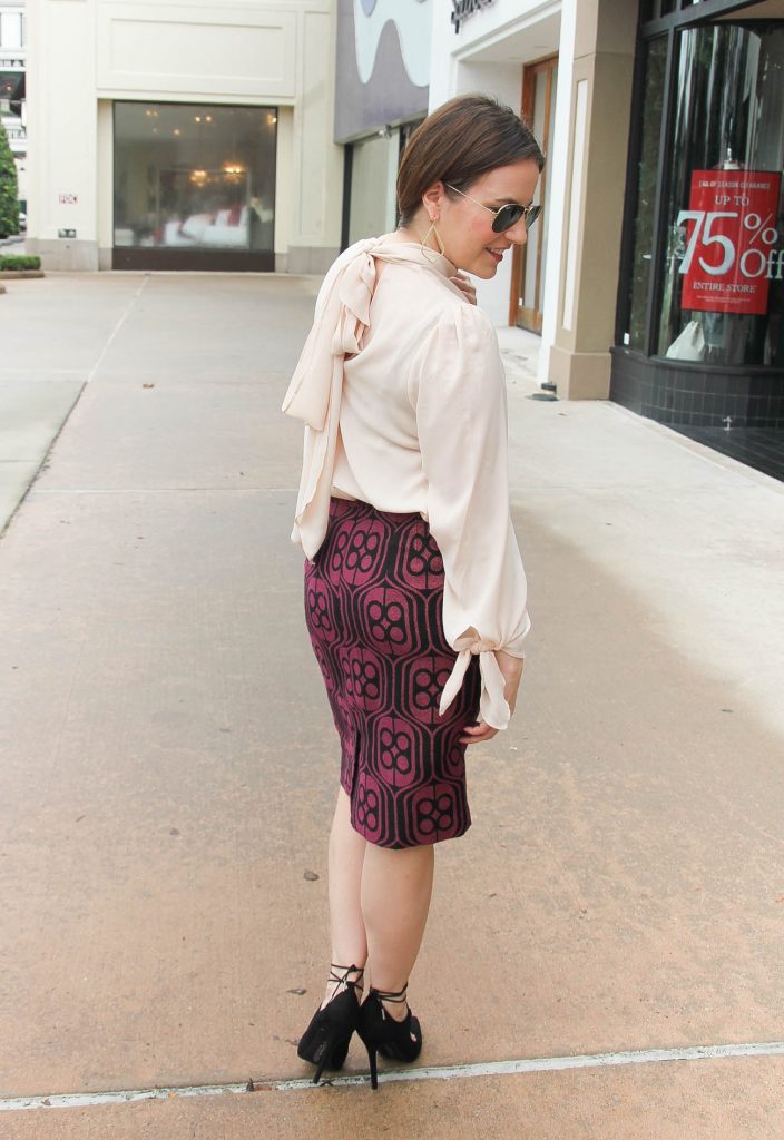 Houston Fashion Blogger Lady in Violet styles a work wear outfit with a bow tie blouse and pencil skirt. Click through for outfit details.