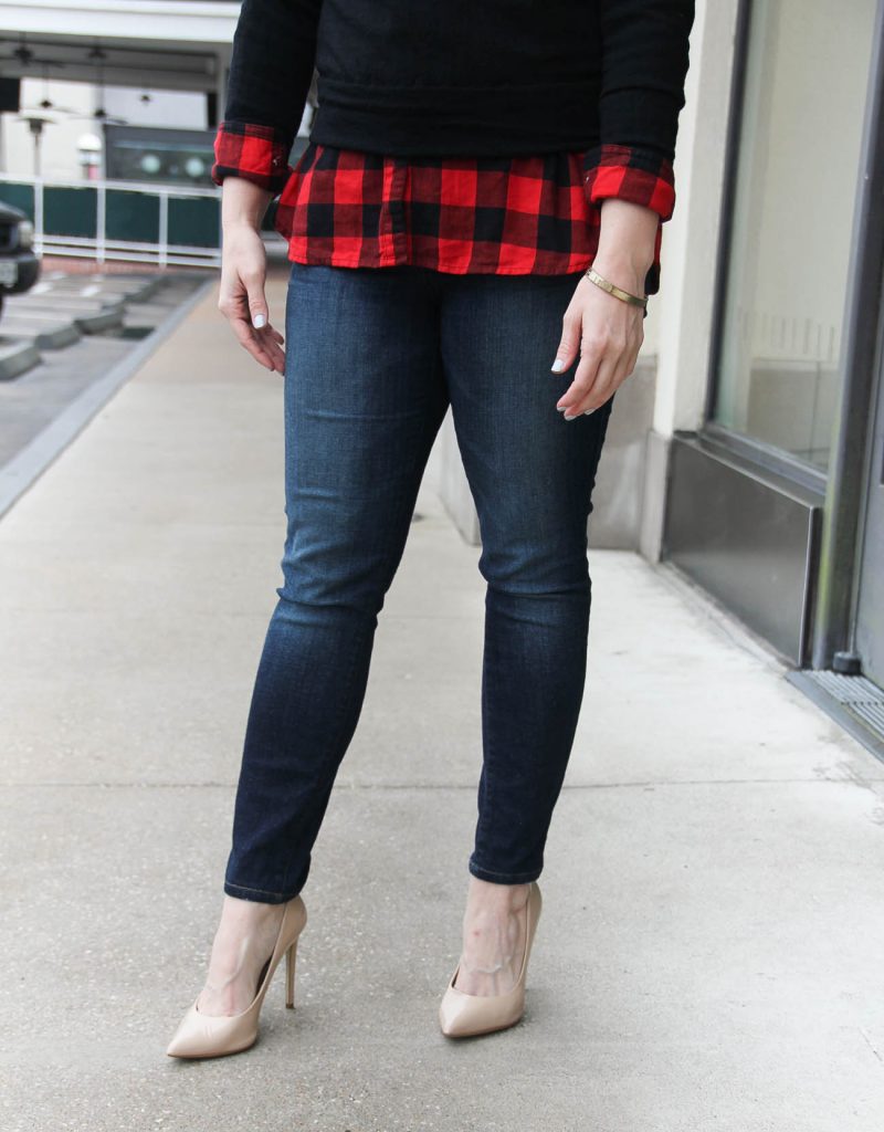 Houston Fashion Blogger wears a buffalo plaid top with a black sweater and skinny jeans. Click through for outfit details.