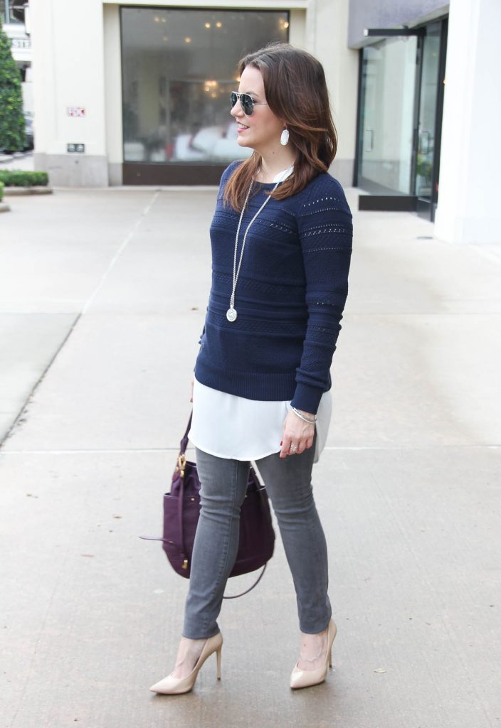 Houston Fashion Blogger Lady in Violet styles a winter outfit idea featuring a navy sweater with gray skinny jeans. Click through for outfit details.