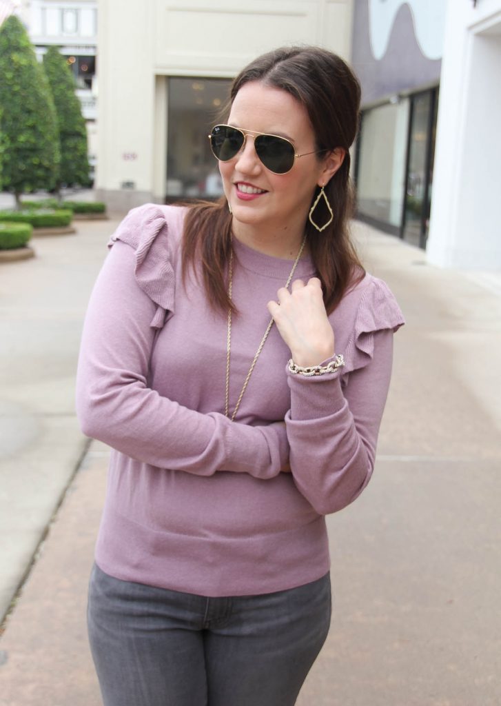 Houston Style Blogger Lady in Violet shows how to wear ruffle sweaters with jeans. Click through to shop outfit.