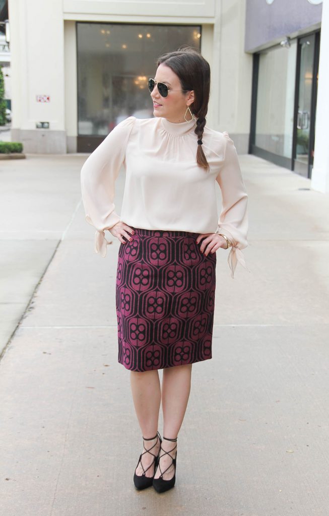 Houston Fashion Blogger Lady in Violet wears a winter work outfit featuring a pencil skirt and long sleeve blouse with lace up heels. Click through for outfit details.