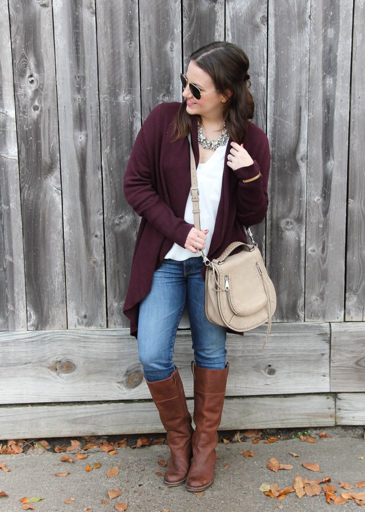 Houston Style Blogger wears a cute fall outfit idea with layers including a long cardigan, white blouse and jeans.