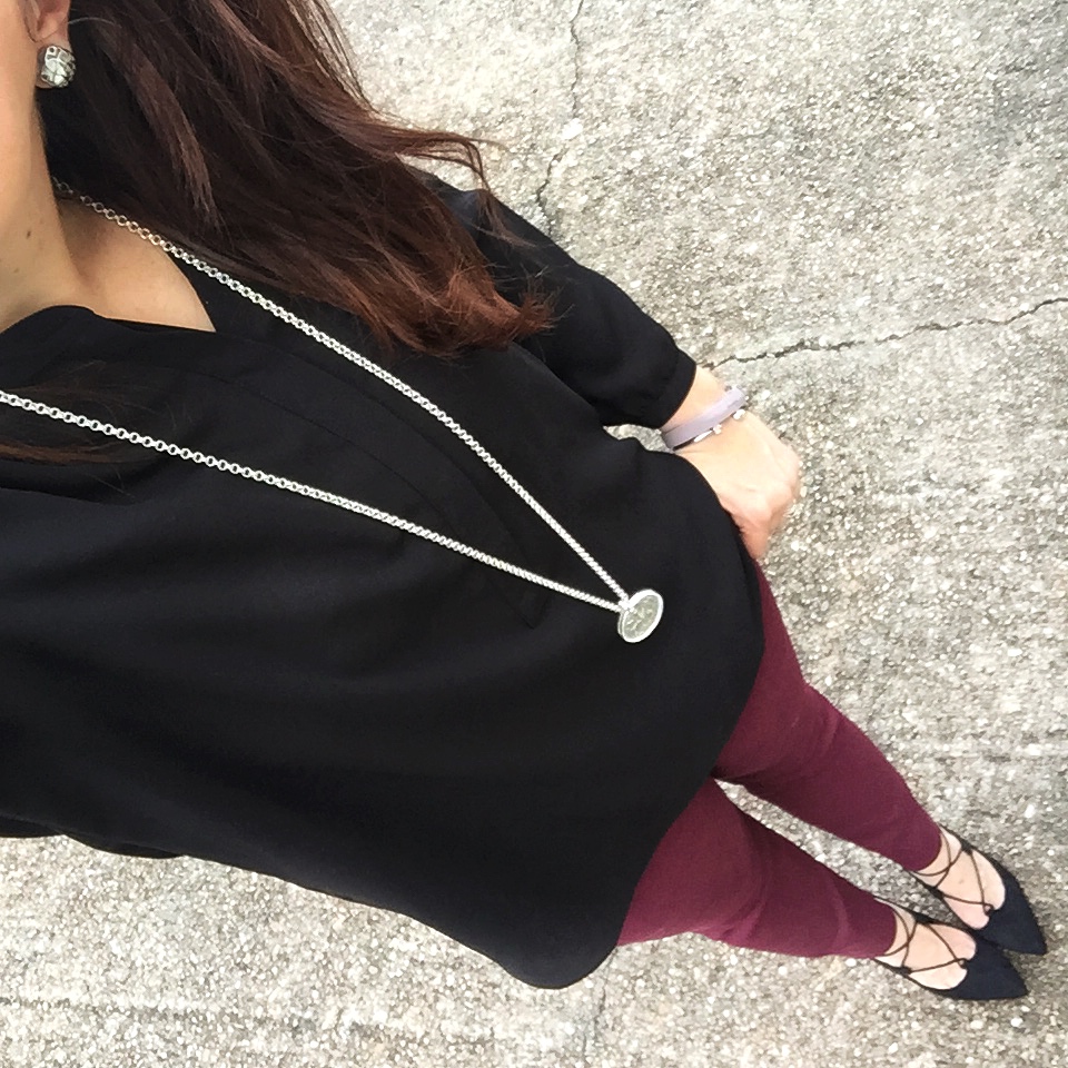 Houston fashion blogger styles a work outfit including burgundy work pants and a black blouse. Click through for outfit details.