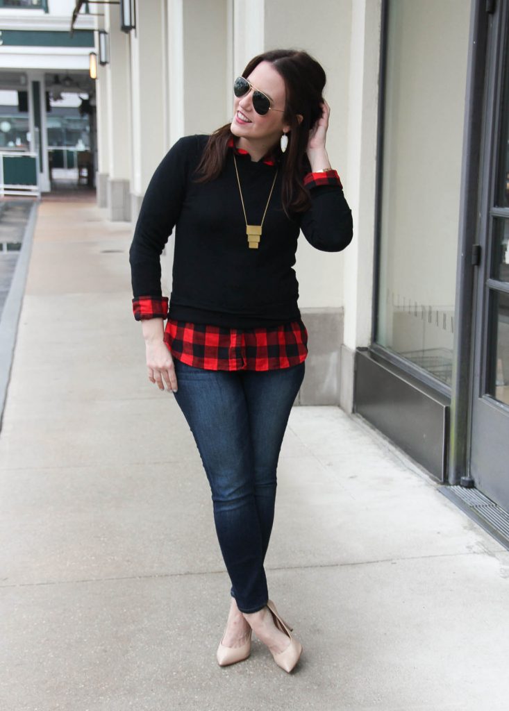 Houston Fashion Blogger Lady in Violet styles a winter outfit idea for casual Friday at the office featuring a black sweater with a red plaid shirt. Click through for outfit details.