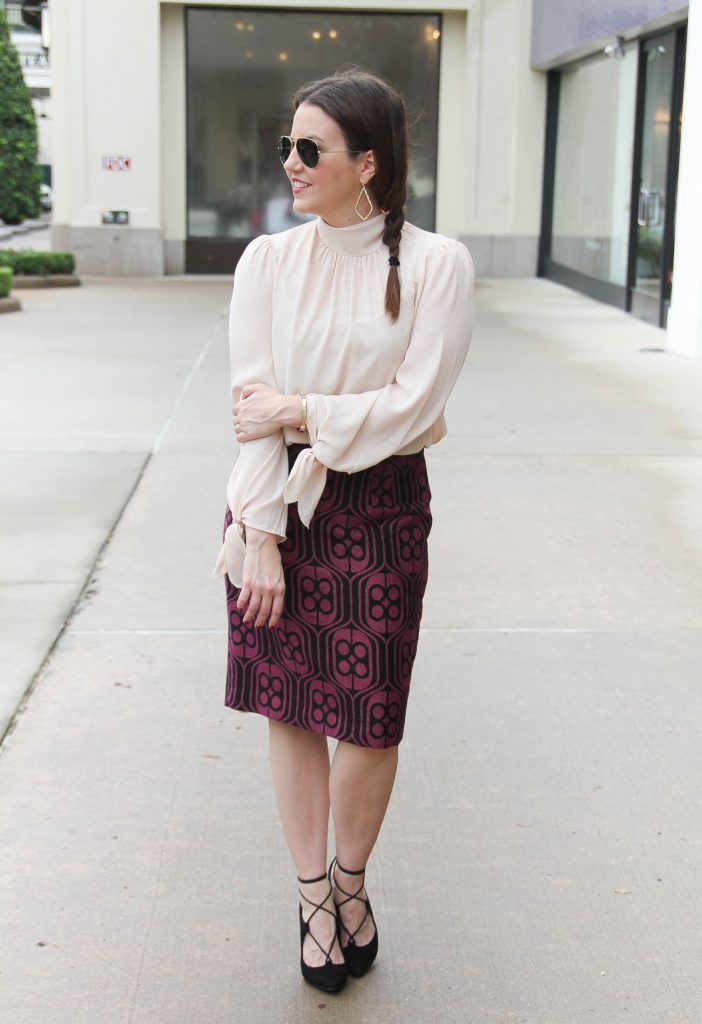 Houston Fashion Blogger styles a winter work outfit featuring a pencil skirt with lace up heels and a turtleneck blouse. Click through for outfit details.