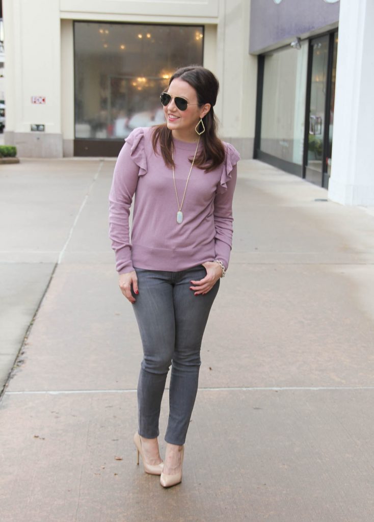 Houston Blogger Lady in Violet styles a dresse up casual winter fashion outfit including gray jeans, a purple ruffle sweater and gold jewelry. Click through for outfit details.