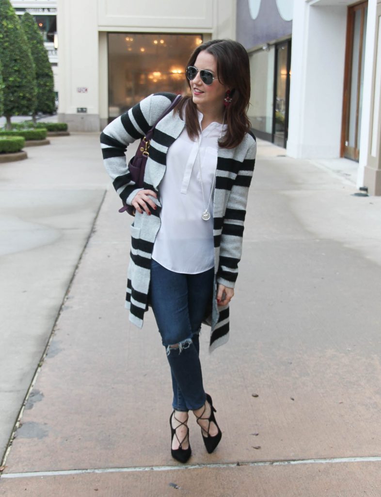 Houston Fashion blogger Karen Rock wears a winter outfit including a striped sweater coat with distressed jeans and black lace up heels. Click through for outfit details.