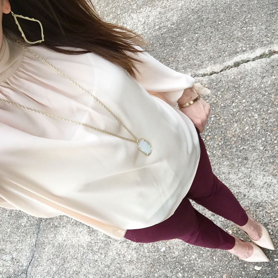 Houston fashion blogger wears a winter work outfit featuring a blush high neck blouse and burgundy pants. Click through for outfit details.
