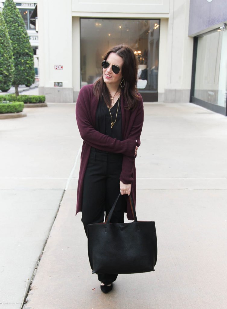 Houston Style Blogger wears a chic office outfit featuring black pants and a burgundy long cardigan.