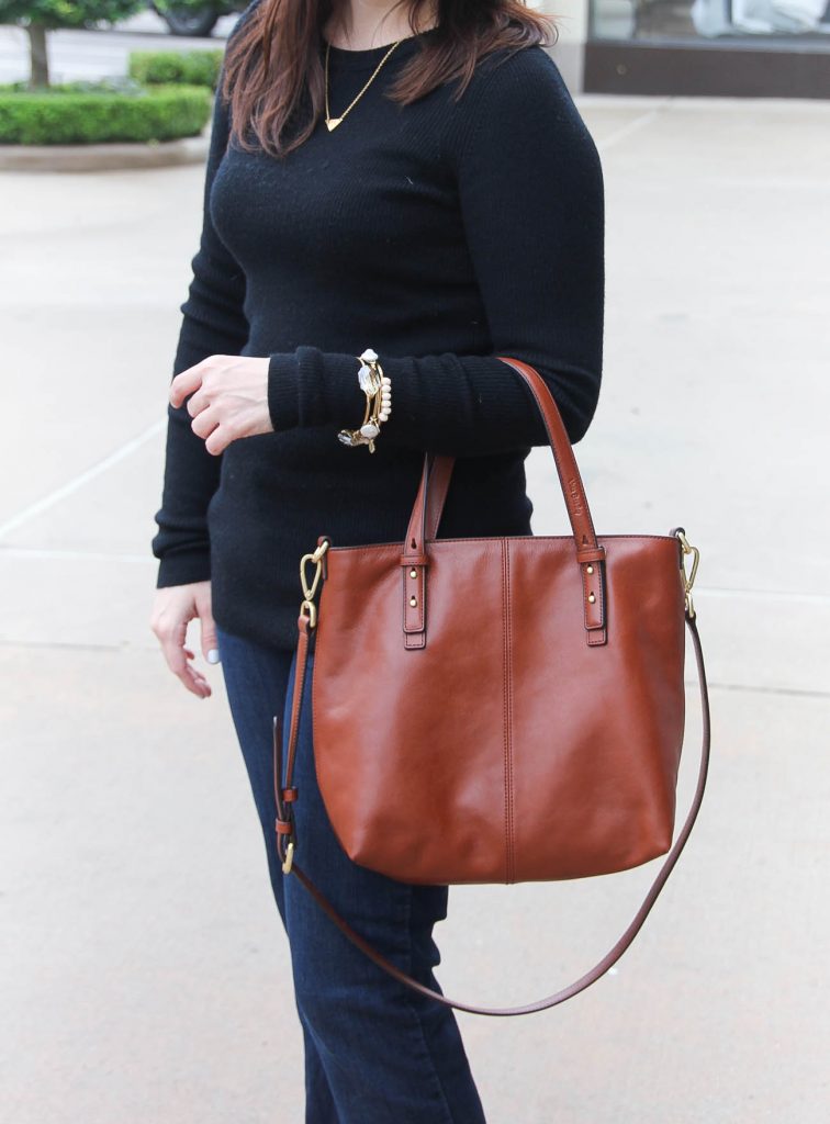 Lady in Violet, a Houston fashion blogger carries a brown satchel tote bag for work.