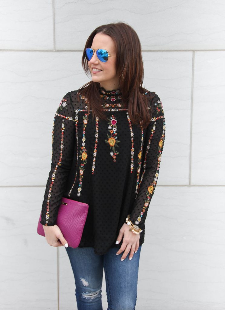 Houston Fashion blogger talks fashion trends in top featuring sheer sleeves and floral embroidery.