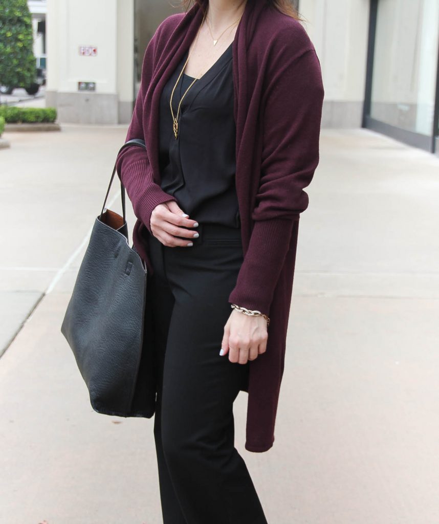 Houston Fashion Blogger styles an office outfit by layering a black blouse with a long cardigan.