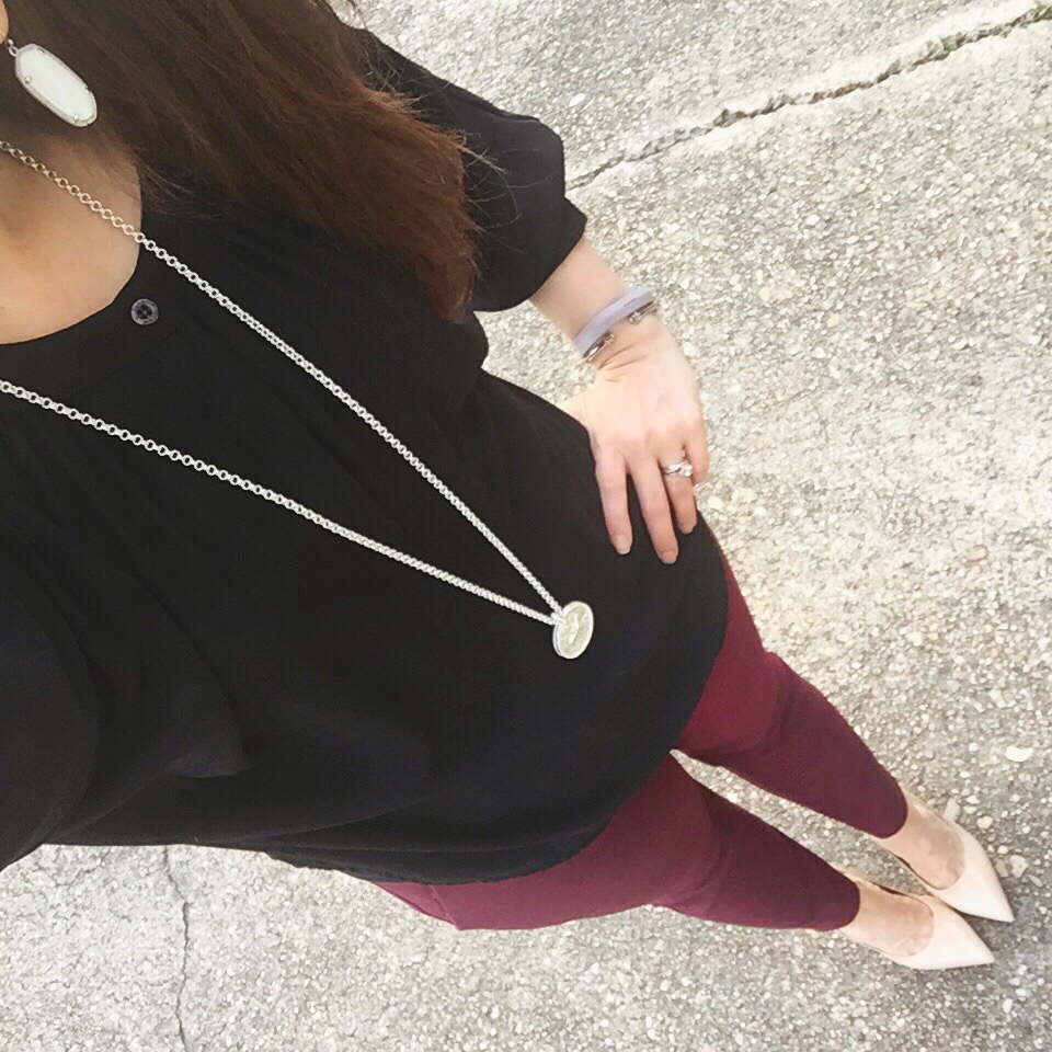 Houston style blogger wears a work outfit with maroon pants.
