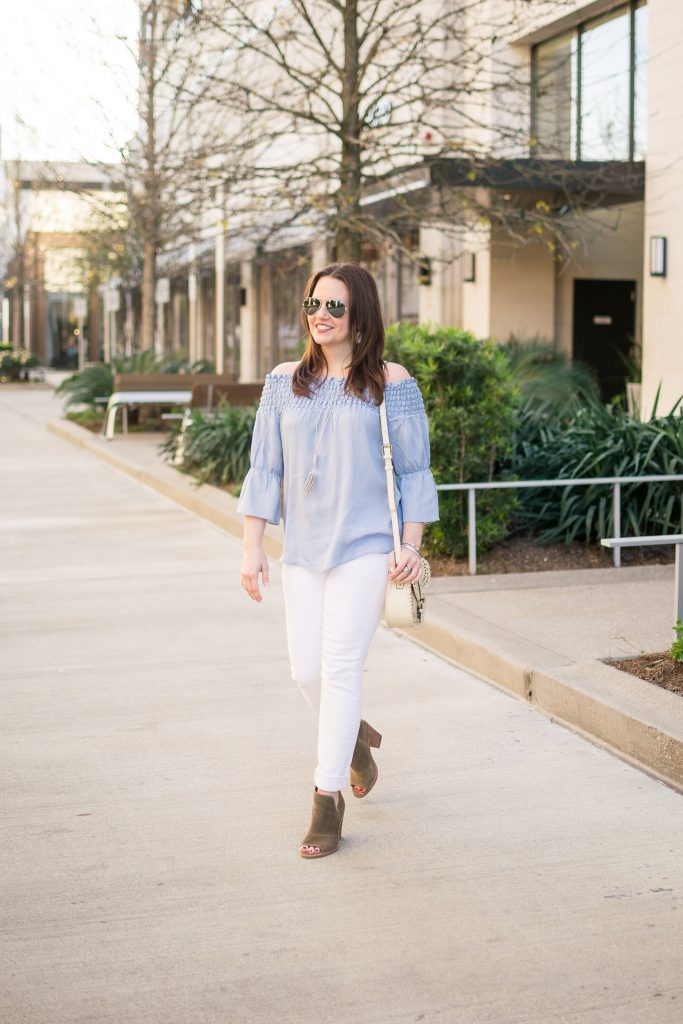 Houston Fashion Blogger, Lady in Violet styles a spring outfit idea including a blue off the shoudler top with white jeans and brown peep toe booties.