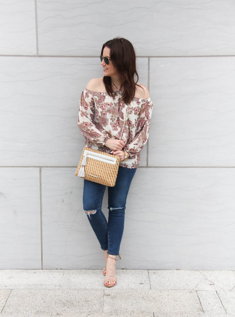 Lady in Violet, a Houston fashion blogger styles spring outfit idea featuring floral cold shouder top with distressed jeans.