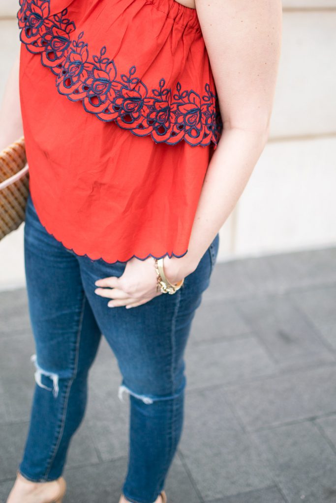 Spring fashion trends of 2017 including a one shoulder top with embroidered details.