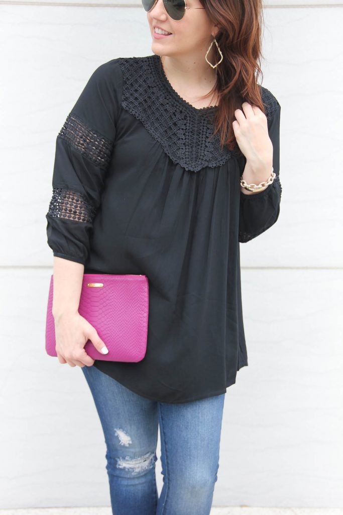 Houston style blogger styles a black crochet top to wear year round with a pink clutch.