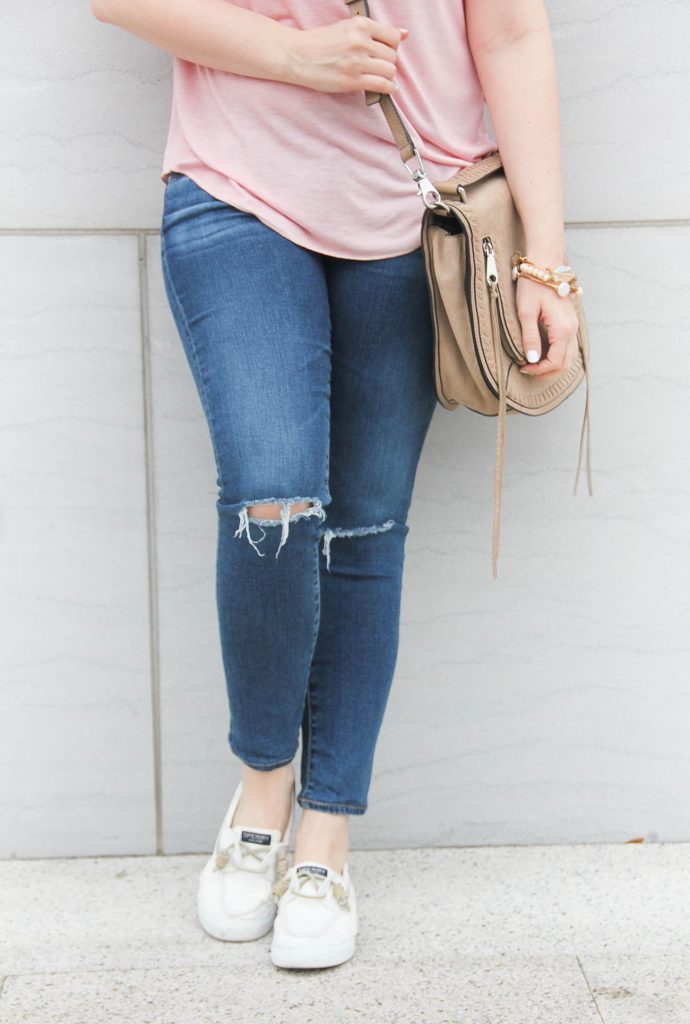 Lady in Violet of Houston wears AG distressed jeans with Sperry white sneakers for a road trip.