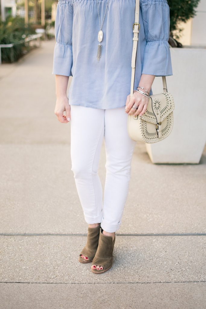 Houston fashion blogger wears spring outfit idea with bell sleeve blouse and white skinny jeans.