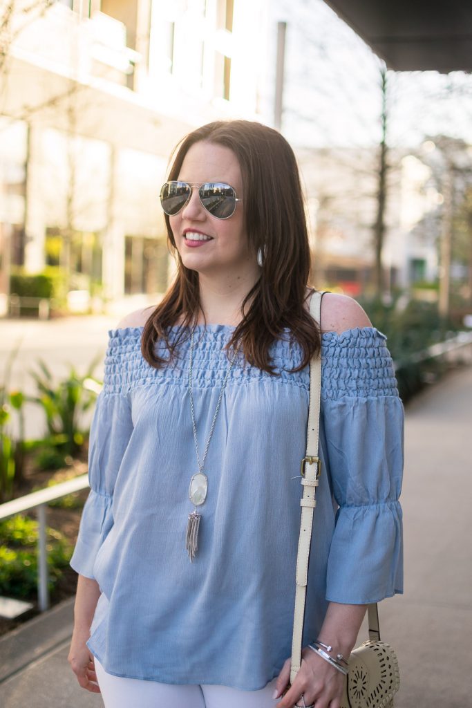 Lady in Violet of Houston styles a casual outfit for brunch including a blue off the shoulder top and Kendra Scott necklace.