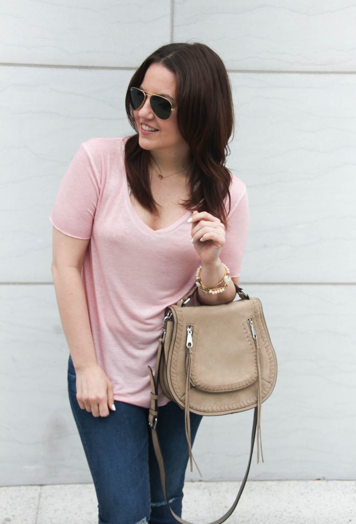 Houston fashion blogger shares what to wear for road trip including a comfy tee and jeans.