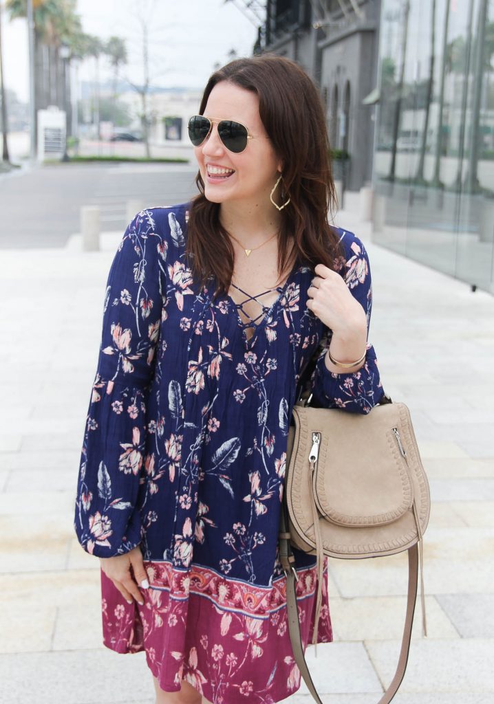 Lady in Violet, a Houston based blogger wears a boho chic dress with gold Kendra Scott earrings.