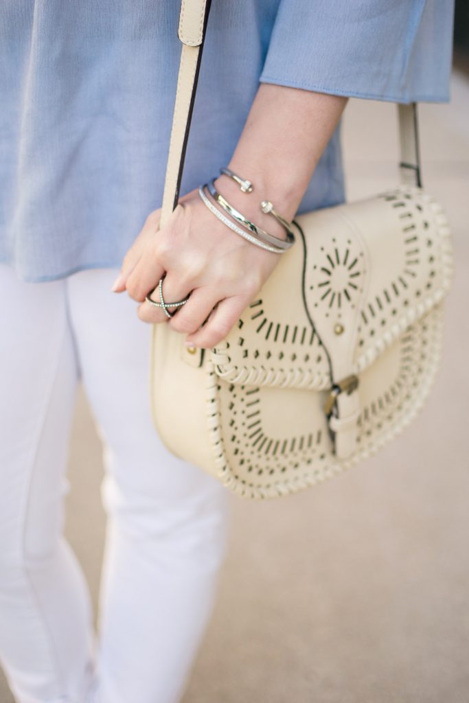 Houston fashion blogger carries the Sole Society kianna crossbody saddle bag in Ivory.