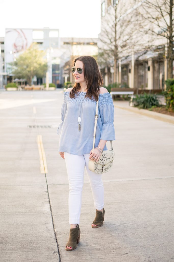 Houston fashion blogger Lady in Violet styles spring outfit inspiration featuring a blue top with white jeans.