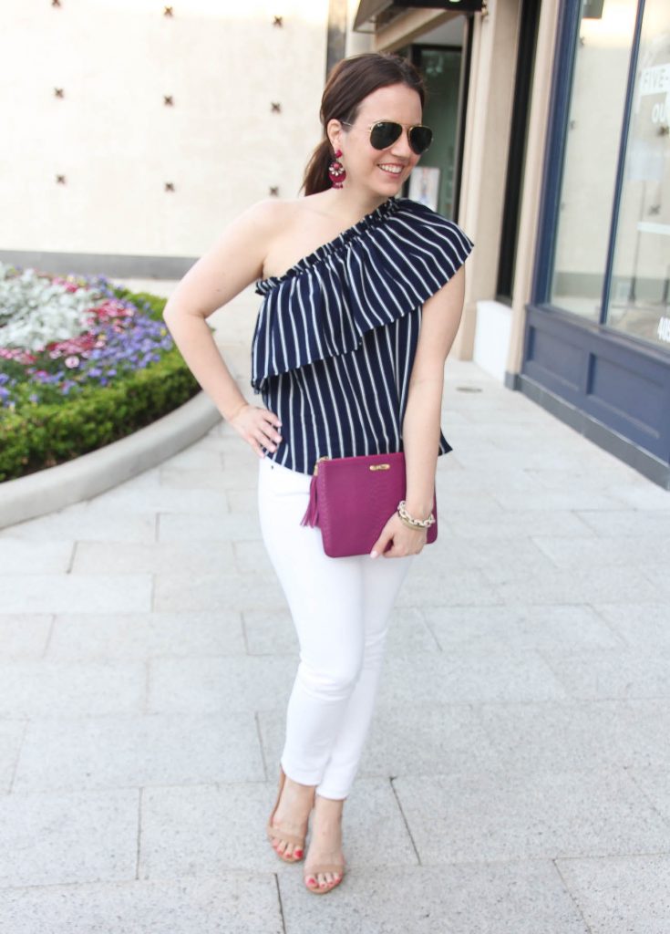 Houston fashion blogger wears a chic Spring outfit idea including a one shoulder top with white jeans.