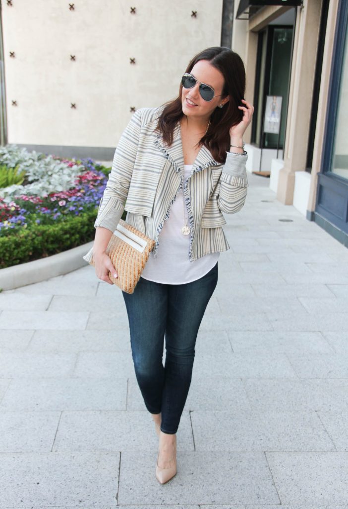 Houston fashion blogger styles a striped spring jacket with a white tank top and skinny jeans.