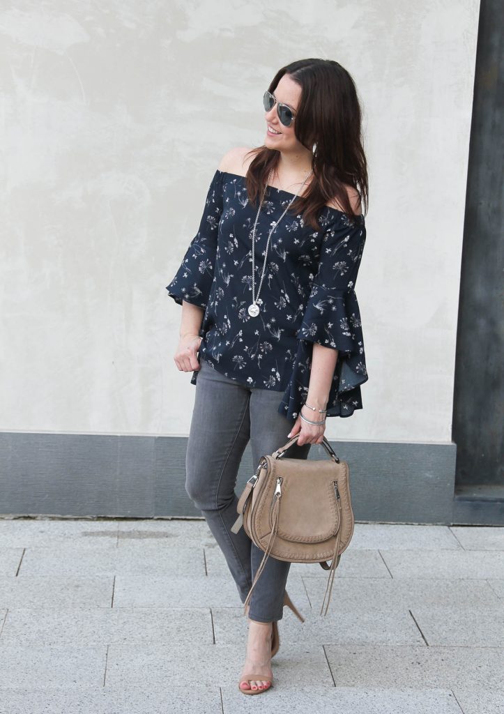 Houston fashion blogger wears a spring outfit idea including a bell sleeve off the shoulder top with gray jeans.