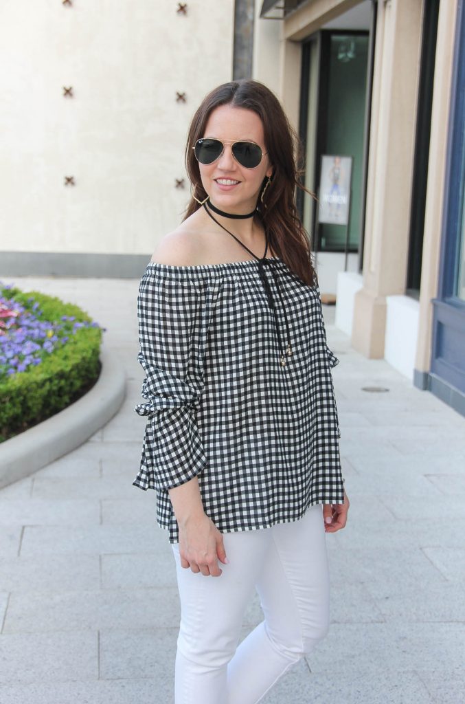 Houston style blogger wears a gingham off the shoulder top with a black wrap choker with long front ties.