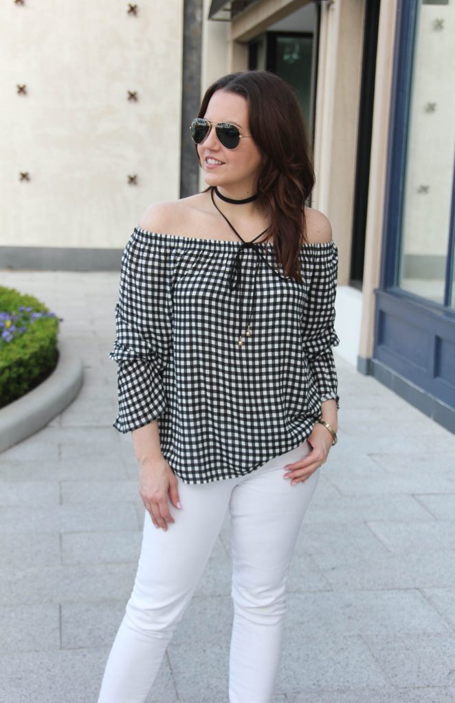 Lady in Violet, a Houston based blogger, wears a spring weekend outfit idea including a gingham off the shoulder top with white skinny jeans and a black choker necklace.