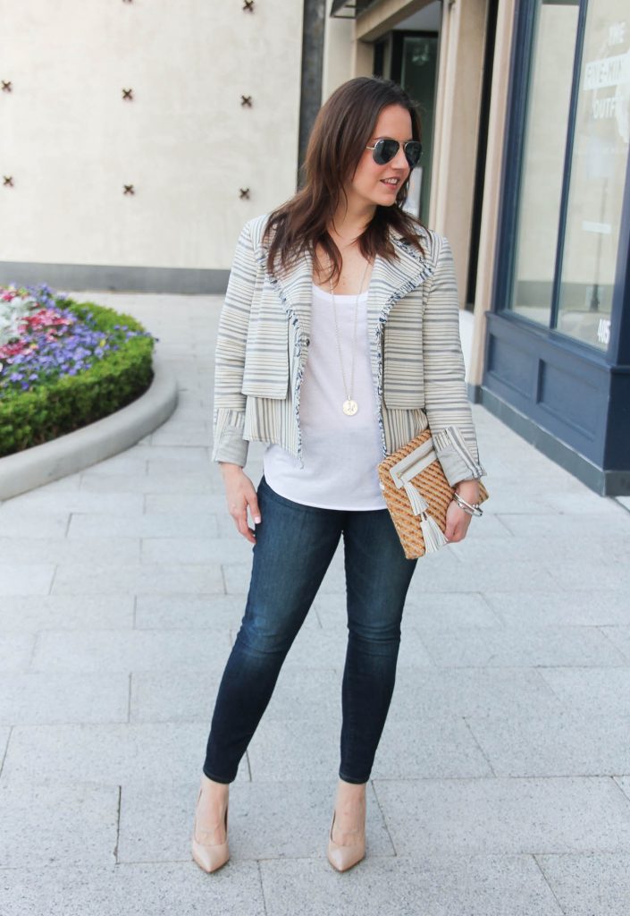 Lady in Violet, a Houston based blogger styles a chic weekend outfit idea with heels, a lightweight jacket, tank top, and jeans.