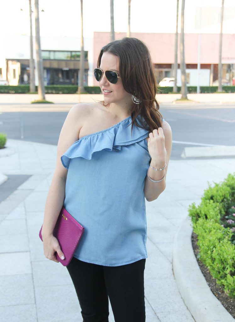 Blogger Lady in Violet styles spring outfit idea including chambray one shoulder top with black skinny jeans.