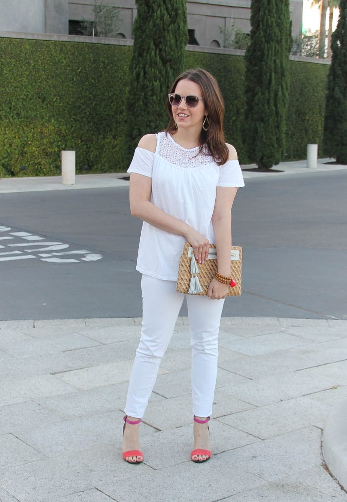 Houston fashion blogger wears white on white outfit for Spring featuring cold shoulder top with pink block heel sandals.