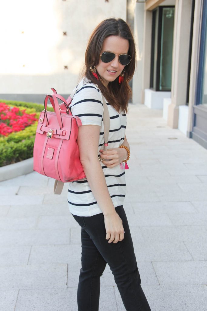 Houston Fashion Blogger carries Henri Bendel mini jetsetter bag in pink.