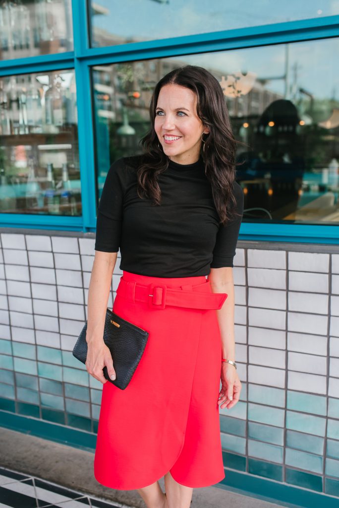 red skirt black top outfit