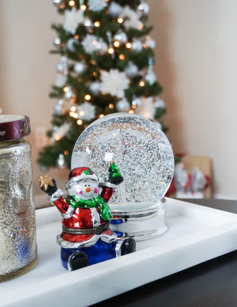 apartment christmas decorations | holiday snow globe | coffee table decor | Houston Lifestyle Blogger Lady in Violet