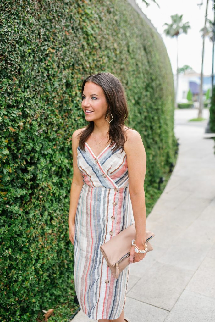 summer wedding outfit | multi colored striped dress | neutral clutch | Houston Fashion Blogger Lady in Violet