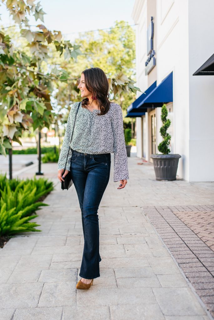 http://ladyinviolet.com/wp-content/uploads/2019/11/a-fall-outfit-polka-dot-bell-sleeve-top-dark-wash-flared-jeans-684x1024.jpg