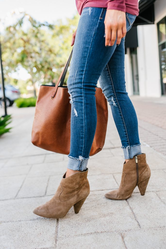 casual outfit | brown western booties | distressed cuffed jeans | Petite Fashion Blog lady in violet