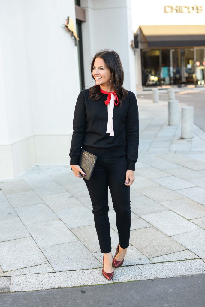 black outfit with red heels