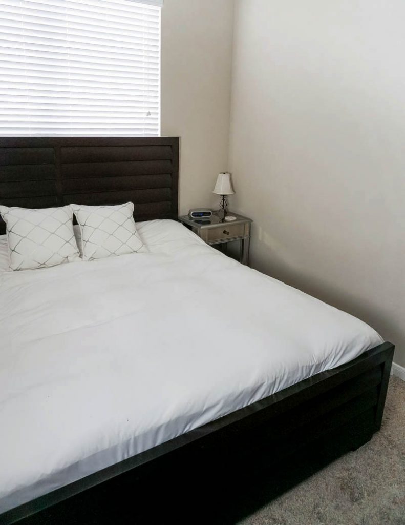 how to make bedroom look bigger | king size bed white comforter | Home decorating blog Lady in Violet