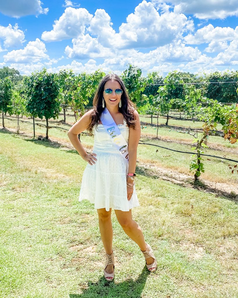 bachelorette party outfit | white eyelett dress | wine tasting bachelorette party | Over 30 Fashion Blogger Lady in violet