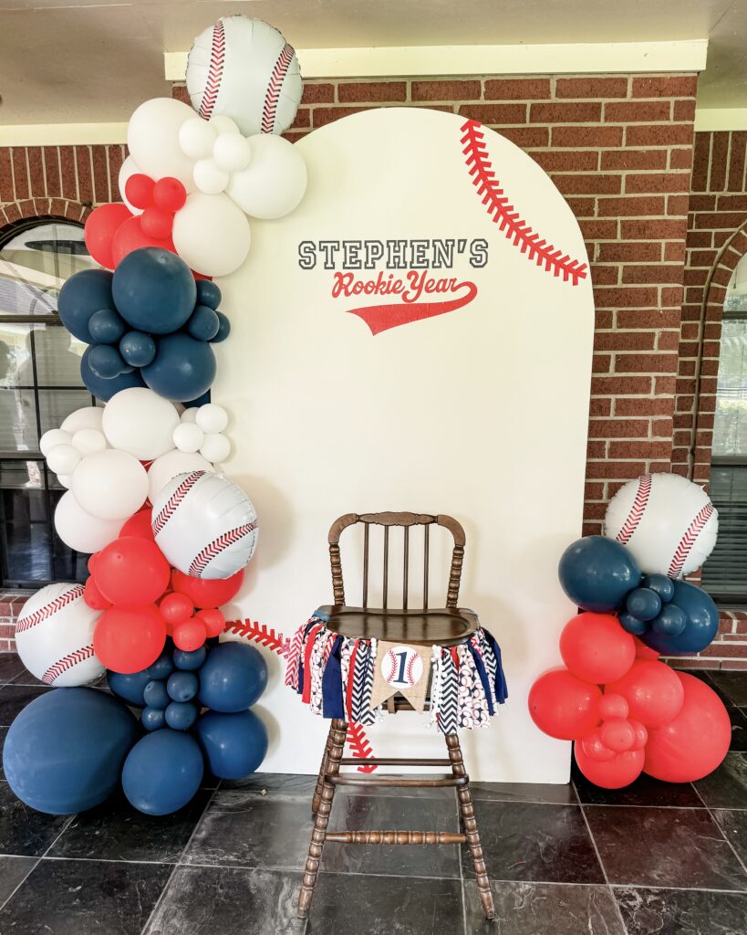 rookie of the year balloon backdrop wall | first birthday high chair banner | Mom Lifestyle Blogger Lady in Violet