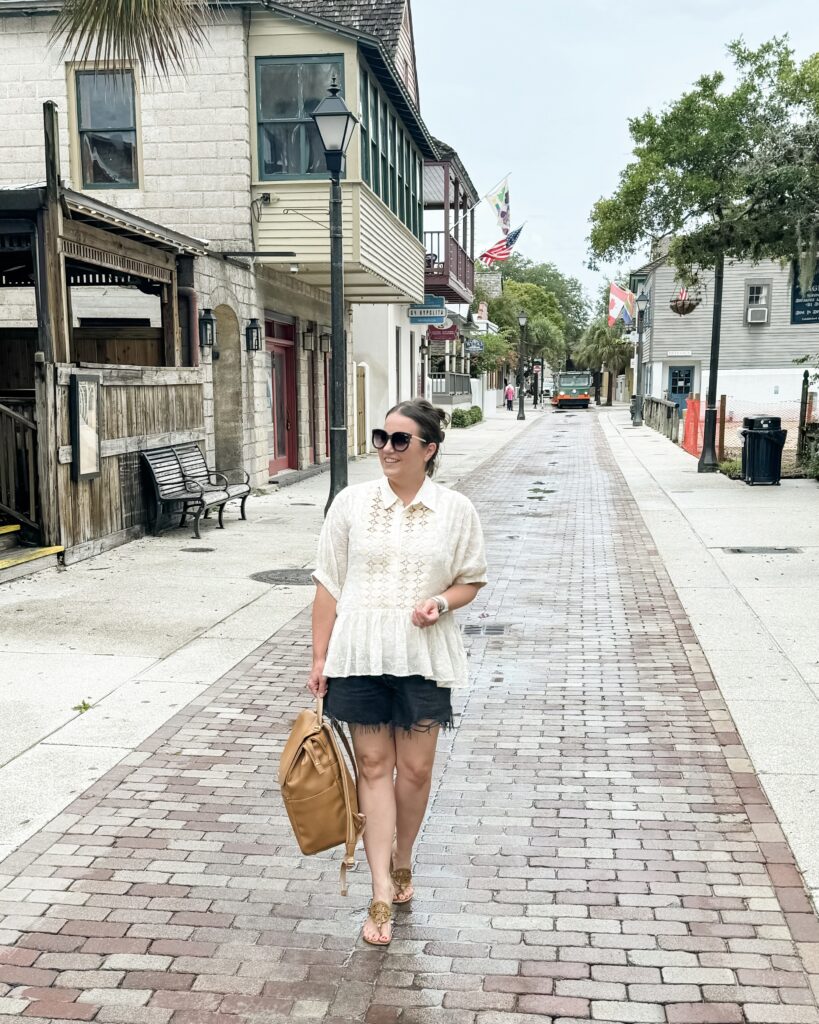 florida vacation outfit | black jean shorts | backpack diaper bag | Lifestyle Influencer Lady in Violet