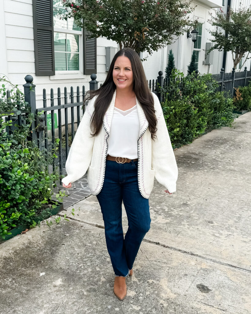 layered fall outfit | off white cardigan sweater | dark blue jeans | Petite Fashion Influencer Lady in Violet